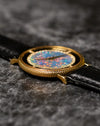 Low side view of Piaget Ref. 9026 emphasizing thin case profile and diamond-set inner bezel