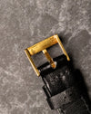 Reverse view of original Piaget 18K yellow gold buckle showing hallmarks and patina