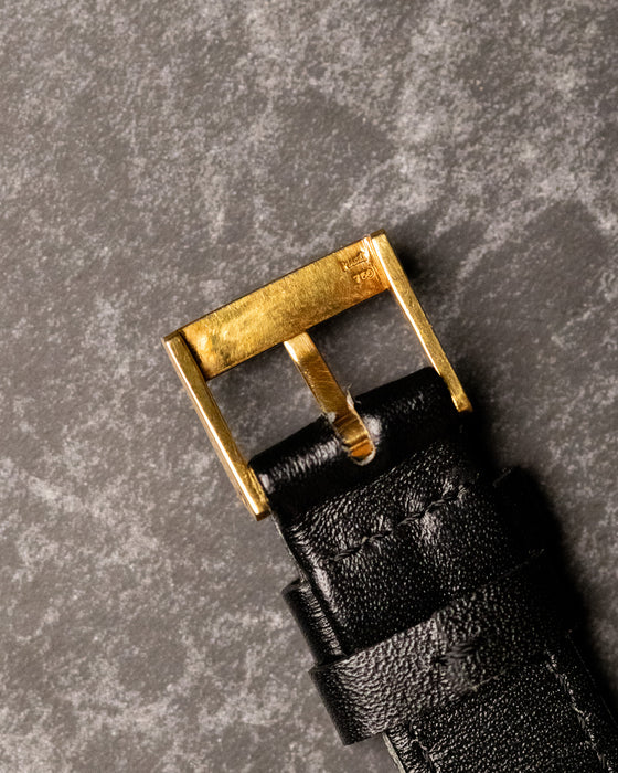 Reverse view of original Piaget 18K yellow gold buckle showing hallmarks and patina