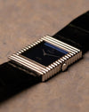Low-angle view of Rolex Cellini 4012 blue mirror dial reflecting light, ribbed case detail