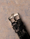 Original Rolex steel buckle fitted to black leather strap on Rolex Cellini 4012
