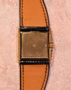 Rear view of the Rolex Cellini Ref. 4015 showing the gold caseback, signed crown, asymmetric case construction, and leather strap.