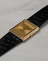 Angled front view of Rolex Cellini Ref. 4016 in 18K yellow gold showing gold dial and rare vertical ribbed rectangular case