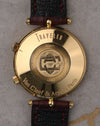 Caseback of Van Cleef & Arpels Traveller showing engraved “Traveller” text, serial numbers, and Van Cleef & Arpels Paris hallmark in 18K gold