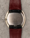 Caseback of Corum Ref. 27119 in 18K white gold with brushed finish and gold hallmark.
