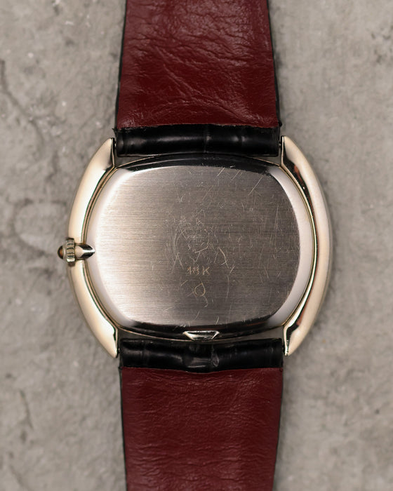 Caseback of Corum Ref. 27119 in 18K white gold with brushed finish and gold hallmark.