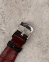 Underside of original Corum steel buckle with Corum branding and Swiss marking.