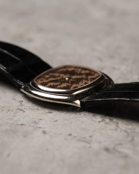Side profile of Corum Ref. 27119 showing slim white gold case and curved cushion-style shape.