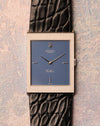Straight-on dial view showing the matte blue Rolex Cellini dial, applied baton markers, and sharply defined hobnail engraved white gold case.