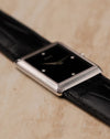 Low side profile of Piaget 9152 emphasizing slim rectangular case and woven white gold texture along the bezel edge.