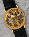 Straight-on dial view of the Universal Genève skeleton watch, focusing on the symmetrical layout of the exposed movement and slim black hands.