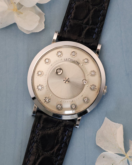 Front view of Jaeger-LeCoultre mystery watch in 14K white gold with diamond hour markers and floating diamond hands