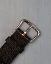 Close-up of the original 14K white-gold buckle with visible gold hallmarks
