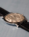 Side profile of the Jaeger-LeCoultre mystery watch highlighting the slim white-gold case and curved lugs