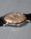 Angled side view showing crown detail and floating diamond indicators beneath the crystal
