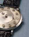 Close-up of the floating diamond minute indicator and brushed central disc