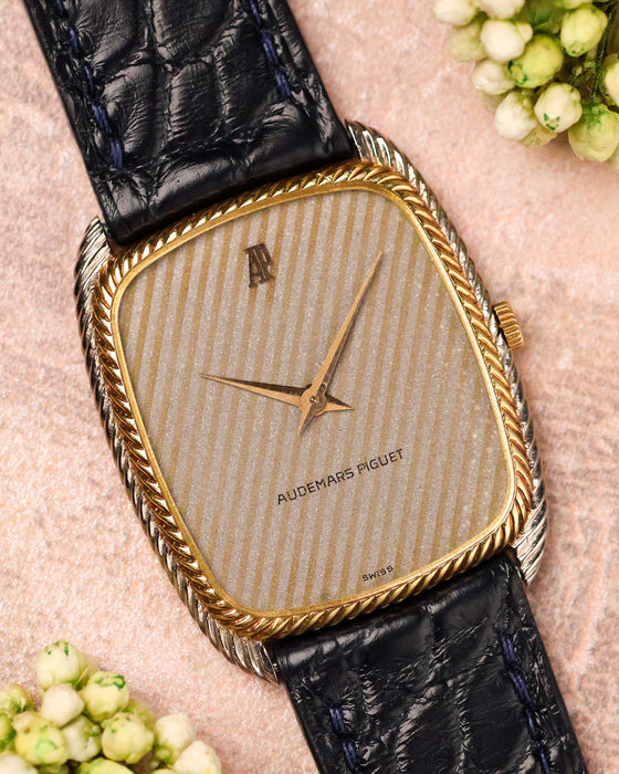 Audemars Piguet ref. 4157 CA tonneau watch with snowflake textured dial and yellow gold rope bezel, front view on leather strap.