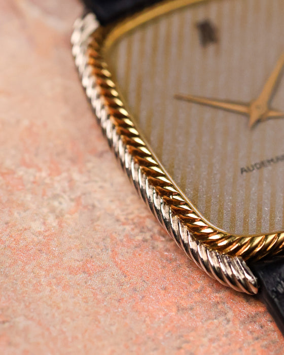 Close-up of Audemars Piguet ref. 4157 CA case edge and dial texture with visible grain and finishing.
