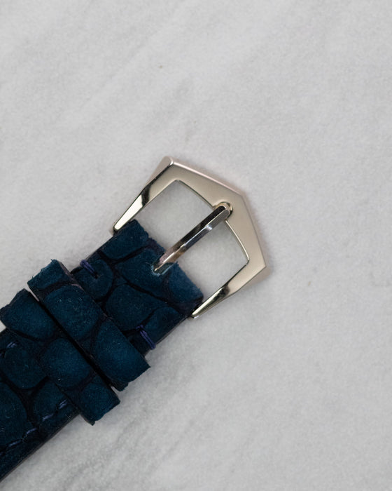 Original Patek Philippe white gold buckle attached to blue leather strap