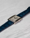 Three-quarter view of Patek Philippe Gondolo 5010 white gold dress watch on blue leather strap