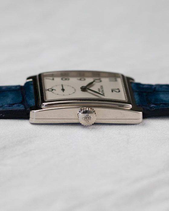Side profile of Patek Philippe Gondolo 5010 in white gold showing curved rectangular case and crown detail