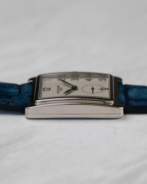 Low side view of Patek Philippe Gondolo 5010 highlighting slim curved white gold case profile