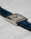 Angled side view of Patek Philippe Gondolo 5010 showing polished case edges and blue leather strap
