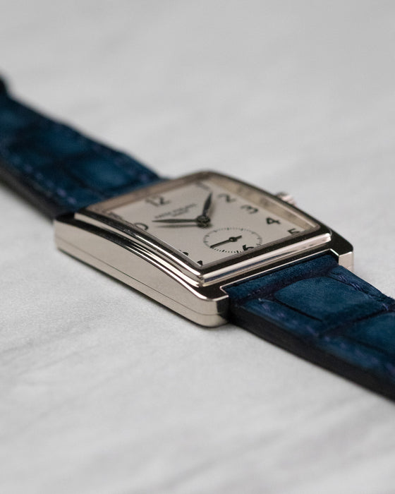 Angled side view of Patek Philippe Gondolo 5010 showing polished case edges and blue leather strap