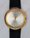 Full frontal view of Rolex Zephyr Ref. 9919 with silver dial, gold hands, and black leather strap