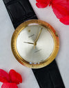 Rolex Zephyr Ref. 9919 front view with silver dial and textured “Disco Volante” bezel, styled with red flowers