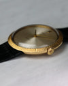 Side profile of Rolex Zephyr showing ultra-slim case, textured bezel, and signed crown