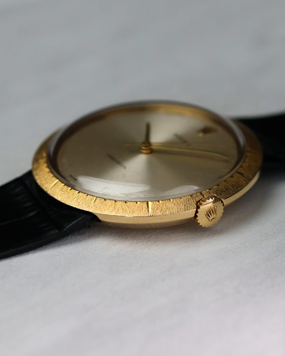 Side profile of Rolex Zephyr showing ultra-slim case, textured bezel, and signed crown