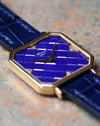 Angled macro view of lapis tile dial showing geometric texture and diamond hour marker at 12 o’clock