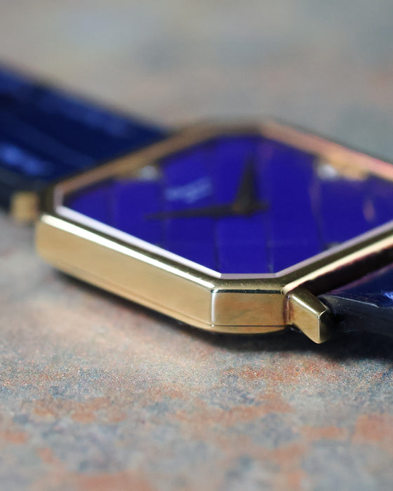 Close-up of signed L.U.C crown on yellow gold case, showing fine detailing and polishing