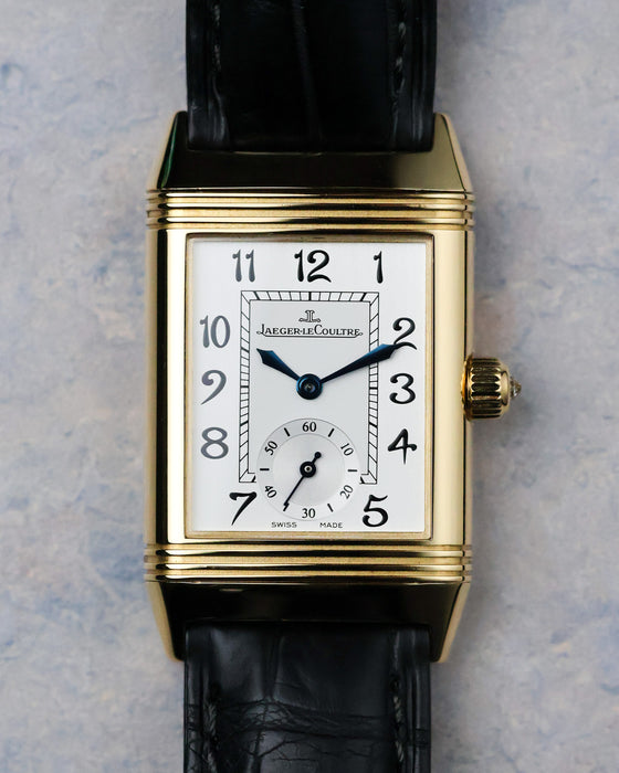 Straight-on view of reverse dial with small seconds and rectangular inner track.