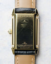 Caseback engraving with “Reverso” and Jaeger-LeCoultre markings showing visible surface wear.