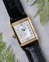 Jaeger-LeCoultre Reverso Duetto front view showing mother-of-pearl dial with Arabic numerals and diamond-set yellow gold case.