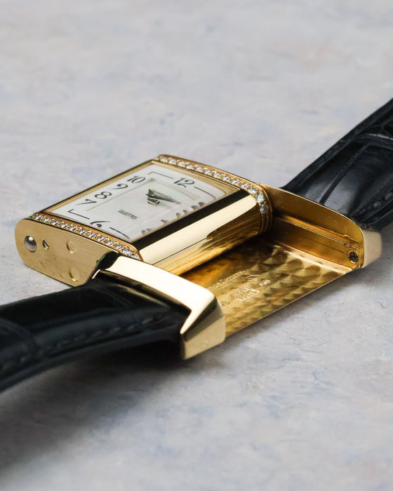 Angled view of the flipped case highlighting interior guilloché pattern and case construction.