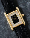 Front view of Cartier Tank LC showing black lacquer centre dial framed by diamond setting.