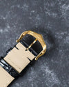 Reverse angle of buckle showing Cartier engravings on gold clasp.