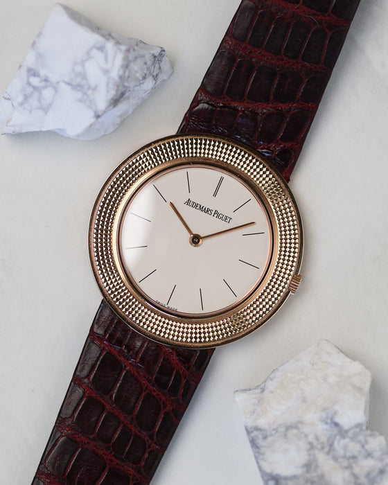 Audemars Piguet 14988OR Disco Volante rose gold watch front view with white dial and textured bezel