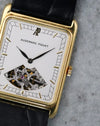 Macro view of the Audemars Piguet dial showing the applied AP logo, geometric minute track and openworked movement.