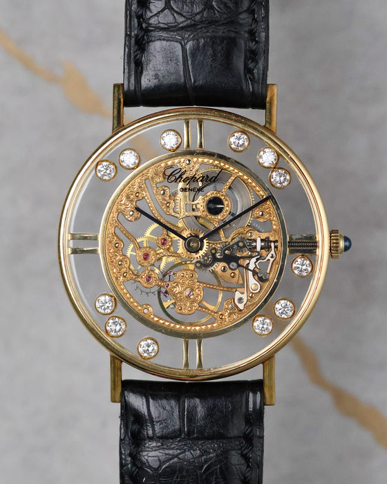Chopard L.U.C Happy Diamonds skeleton dial watch in 18k yellow gold with floating diamonds front view.