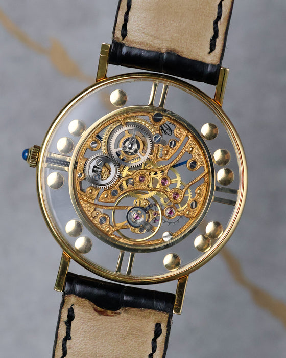 Chopard L.U.C Happy Diamonds skeleton dial watch caseback showing engraved movement in 18k yellow gold.