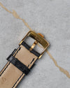 Reverse side of Chopard L.U.C Happy Diamonds buckle showing Swiss hallmark and gold finish.