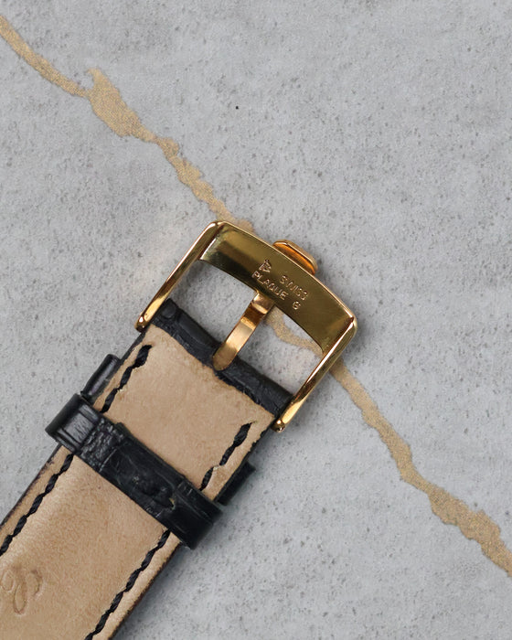Reverse side of Chopard L.U.C Happy Diamonds buckle showing Swiss hallmark and gold finish.