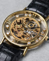 Low angle detail of Chopard L.U.C Happy Diamonds skeleton dial and floating diamonds in gold case.