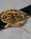 Side profile of Chopard L.U.C Happy Diamonds showing crown with blue cabochon and slim lugs