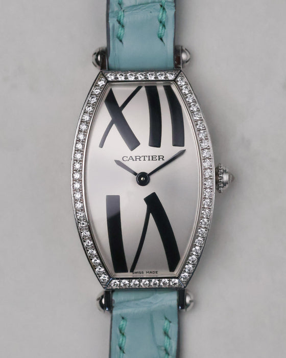 Front view of the Cartier Tonneau WE400731 with factory diamond-set bezel and oversized Roman numerals.