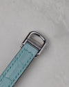 Cartier white gold deployant buckle attached to a light blue leather strap for the Tonneau WE400731.